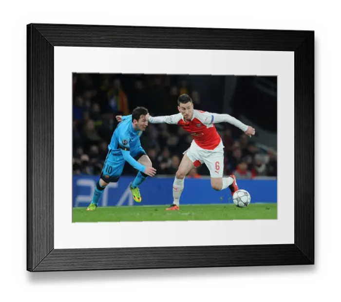 Framed Print : Koscielny vs. Messi: Arsenal's Defensive Battle in Champions League Clash