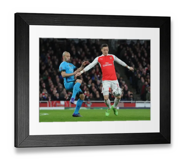 Framed Print : Ozil vs. Mascherano: A Champions League Battle at the Emirates