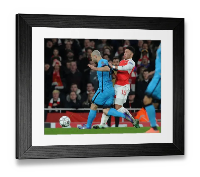 Framed Print : Arsenal's Oxlade-Chamberlain Suffers Injury in Clash with Mascherano during Arsenal v Barcelona UCL Clash (2016)