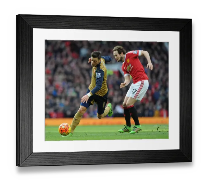 Framed Print : Mesut Ozil Outmaneuvers Daley Blind: Premier League Showdown between Manchester United and Arsenal (2015 / 16)