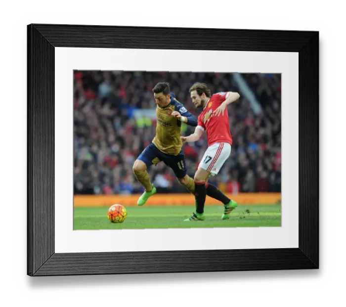 Framed Print : Mesut Ozil Outsmarts Daley Blind: Premier League Clash between Arsenal and Manchester United (2015 / 16)