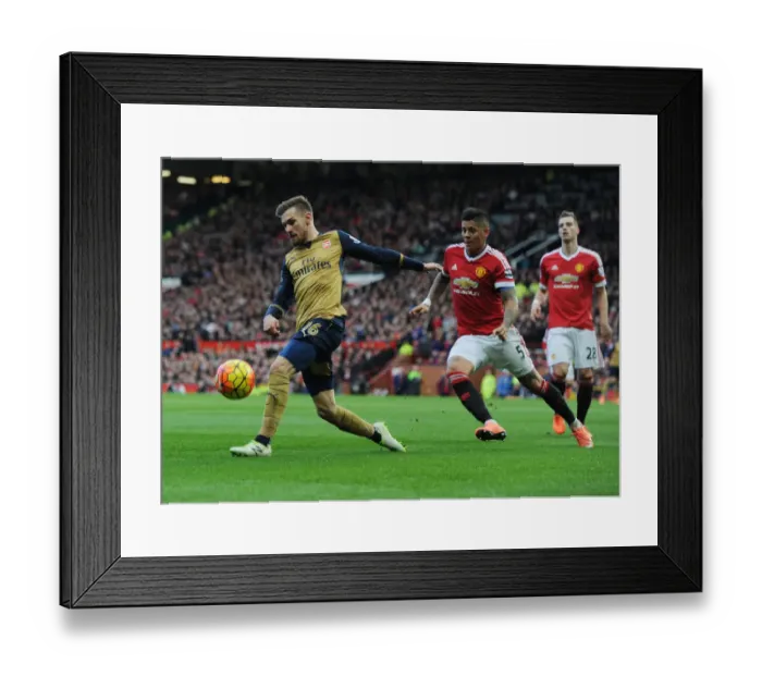 Framed Print : Ramsey vs Rojo: A Footballing Battle at Old Trafford - Premier League 2015 / 16: Arsenal's Ramsey Outmuscles United's Rojo Framed Print : Ramsey vs Rojo: A Footballing Battle at Old Trafford - Premier League 2015 / 16: Arsenal's Ramsey Outmuscles United's Rojo