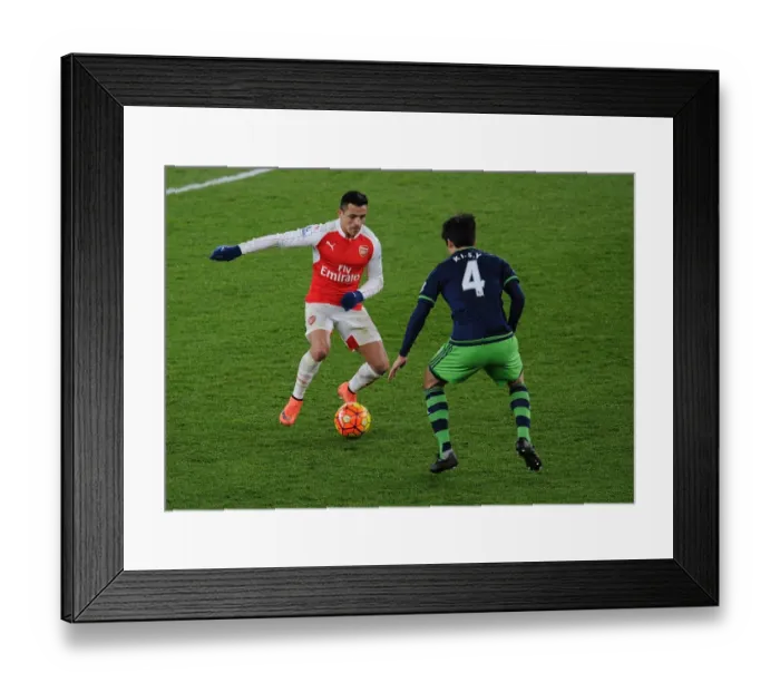 Framed Print : Battle of Midfield Stars: Alexis Sanchez vs Ki Sung-Yueng - Arsenal vs Swansea City Framed Print : Battle of Midfield Stars: Alexis Sanchez vs Ki Sung-Yueng - Arsenal vs Swansea City