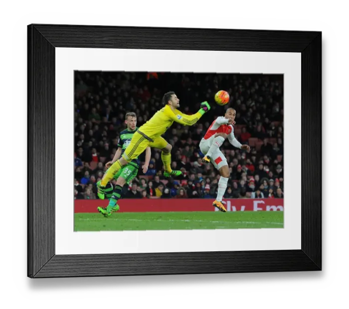 Framed Print : Theo Walcott vs. Lukasz Fabianski: A Premier League Showdown at Arsenal's Emirates Stadium