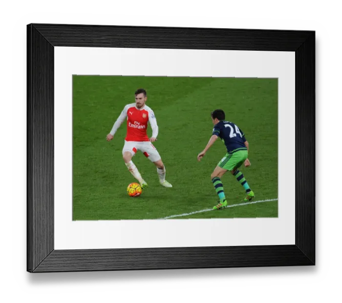 Framed Print : Ramsey vs Cork: Clash of the Midfield Titans in Arsenal vs Swansea Premier League Battle Framed Print : Ramsey vs Cork: Clash of the Midfield Titans in Arsenal vs Swansea Premier League Battle