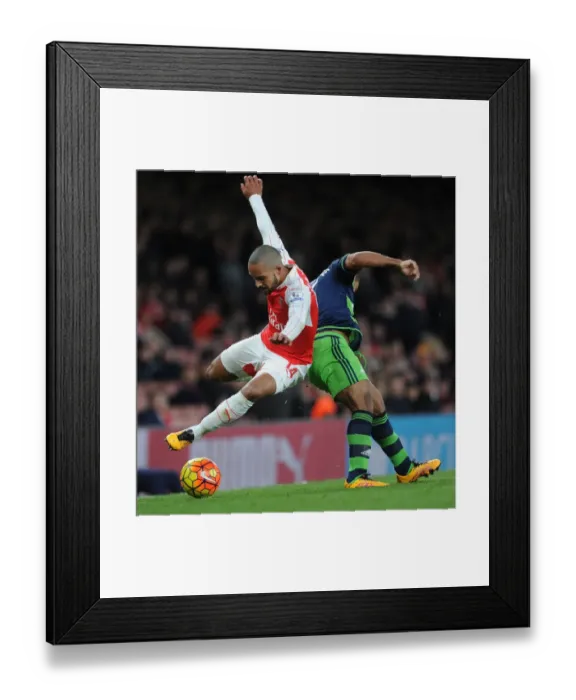 Framed Print : Theo Walcott vs Wayne Routledge: A Premier League Battle at Emirates Stadium Framed Print : Theo Walcott vs Wayne Routledge: A Premier League Battle at Emirates Stadium