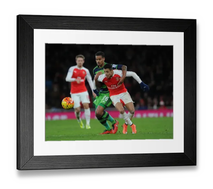 Framed Print : Sanchez vs. Naughton: A Battle of Wits in Arsenal's Triumph over Swansea City