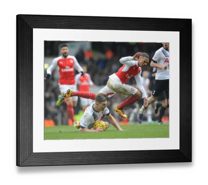 Framed Print : Clash at White Hart Lane: Gibbs vs. Wimmer - Arsenal vs. Tottenham's Intense Battle in the Premier League