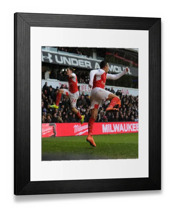 Framed Print : Alexis Sanchez and Hector Bellerin: Arsenal's Unstoppable Duo Celebrate Goals Against Tottenham in the 2015-16 Premier League