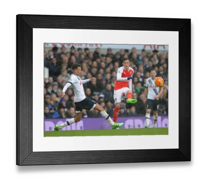 Framed Print : Mesut Ozil vs. Dele Alli: A Football Rivalry Unfolds in the Arsenal vs. Tottenham Clash Framed Print : Mesut Ozil vs. Dele Alli: A Football Rivalry Unfolds in the Arsenal vs. Tottenham Clash