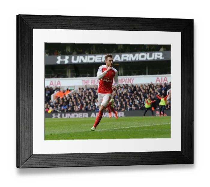 Framed Print : Aaron Ramsey's Euphoric Goal Celebration: Arsenal's Triumph Over Tottenham Hotspur (2015-16) Framed Print : Aaron Ramsey's Euphoric Goal Celebration: Arsenal's Triumph Over Tottenham Hotspur (2015-16)