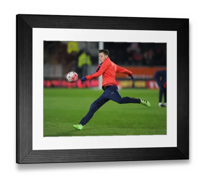Framed Print : Mesut Ozil's Focus: Arsenal's Preparation for FA Cup Replay vs. Hull City