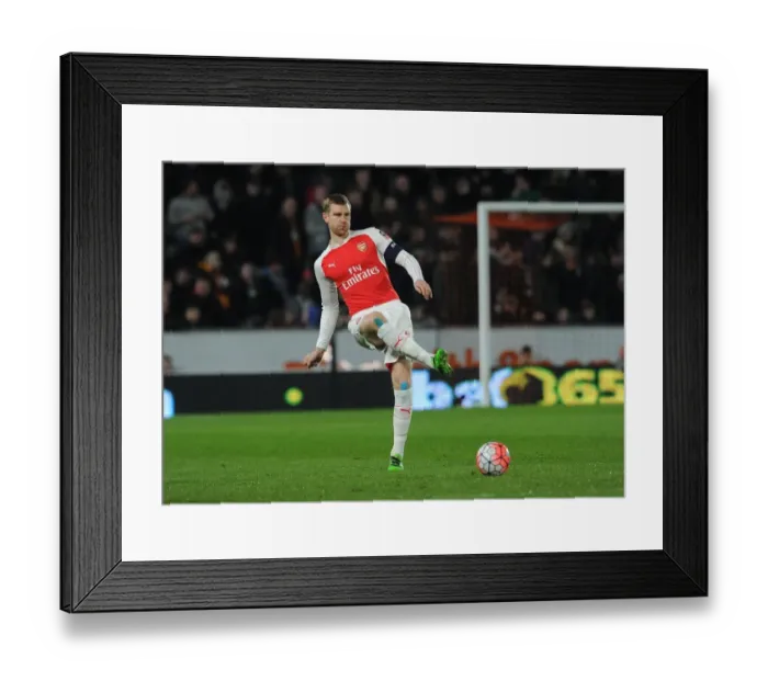 Framed Print : Per Mertesacker's Focus: Arsenal's Defender in FA Cup Fifth Round Replay against Hull City Framed Print : Per Mertesacker's Focus: Arsenal's Defender in FA Cup Fifth Round Replay against Hull City