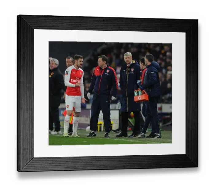 Framed Print : Arsene Wenger and Aaron Ramsey Consult Arsenal's Physio during Hull City FA Cup Match Framed Print : Arsene Wenger and Aaron Ramsey Consult Arsenal's Physio during Hull City FA Cup Match