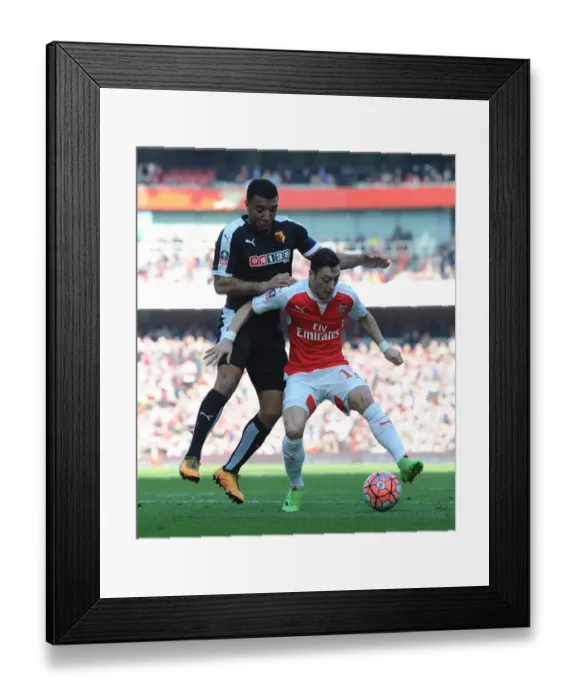 Framed Print : Ozil vs. Deeney: FA Cup Sixth Round Battle at Arsenal