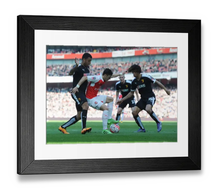 Framed Print : Arsenal's Ozil Outmaneuvers Watford Defenders in FA Cup Showdown Framed Print : Arsenal's Ozil Outmaneuvers Watford Defenders in FA Cup Showdown