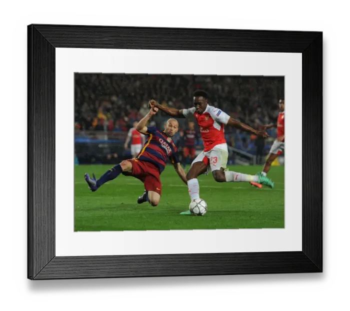 Framed Print : Clash at Camp Nou: Welbeck vs Mascherano - UEFA Champions League Battle