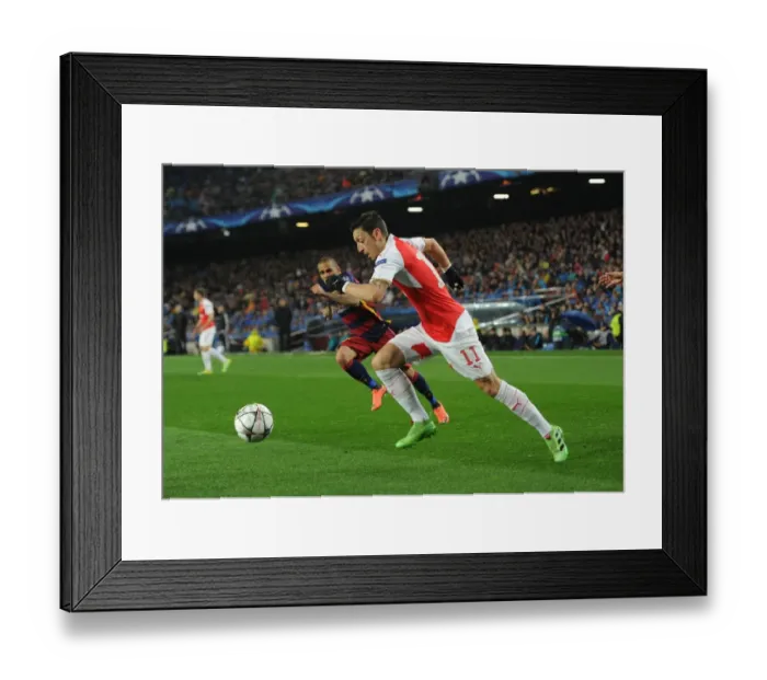 Framed Print : Clash of Champions League Titans: Mesut Ozil vs Dani Alves