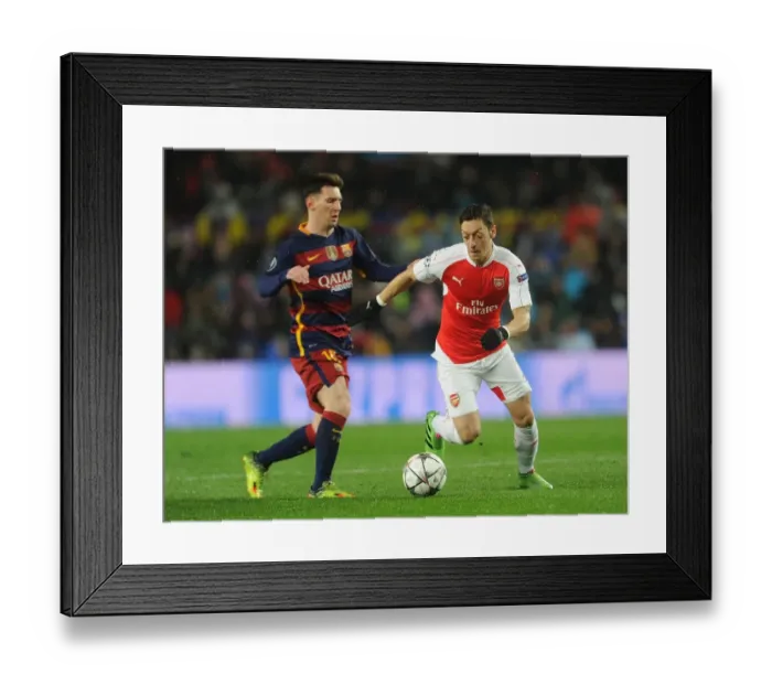 Framed Print : Mesut Ozil vs. Lionel Messi: A Champion's Battle - Arsenal vs. Barcelona