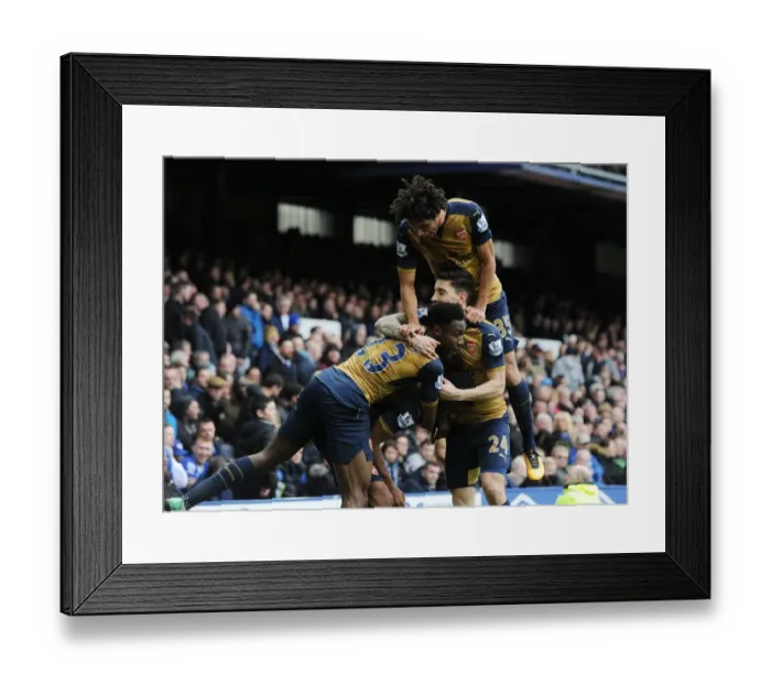 Framed Print : Arsenal Celebrate Double Strike: Iwobi, Welbeck, Bellerin, and Elneny Rejoice After Goals vs. Everton (2015-16)