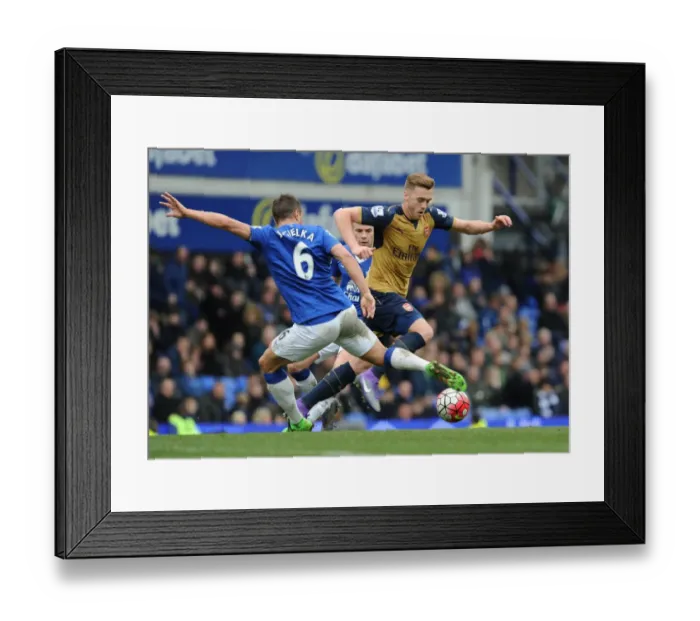 Framed Print : Clash at Goodison Park: A Head-to-Head Battle Between Calum Chambers and Phil Jagielka