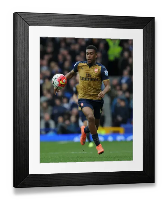 Framed Print : Arsenal's Alex Iwobi Goes Head-to-Head with Everton in Intense Premier League Clash (2015-16) Framed Print : Arsenal's Alex Iwobi Goes Head-to-Head with Everton in Intense Premier League Clash (2015-16)