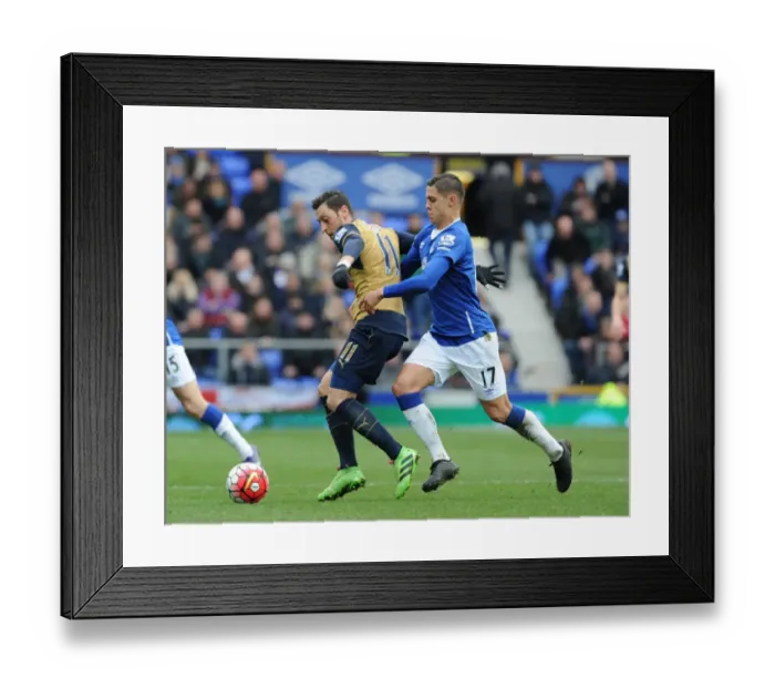 Framed Print : Mesut Ozil vs Muhamed Besic: A Premier League Showdown at Goodison Park