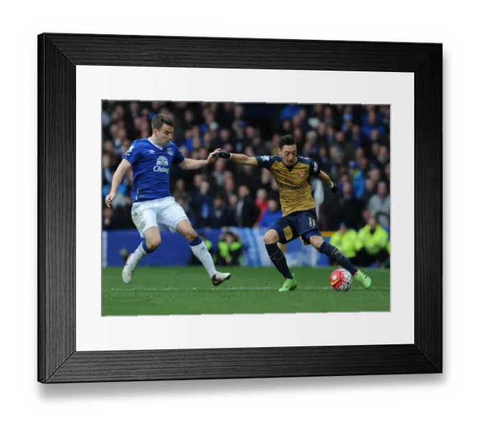 Framed Print : Mesut Ozil vs Seamus Coleman: A Battle at Goodison Park, Premier League 2015-16