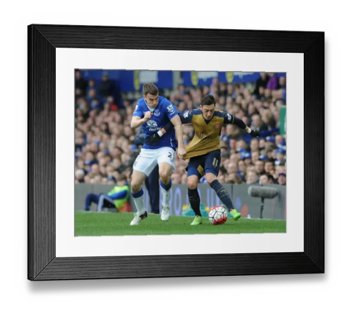 Framed Print : Mesut Ozil (Arsenal) Seamus Coleman (Everton)
