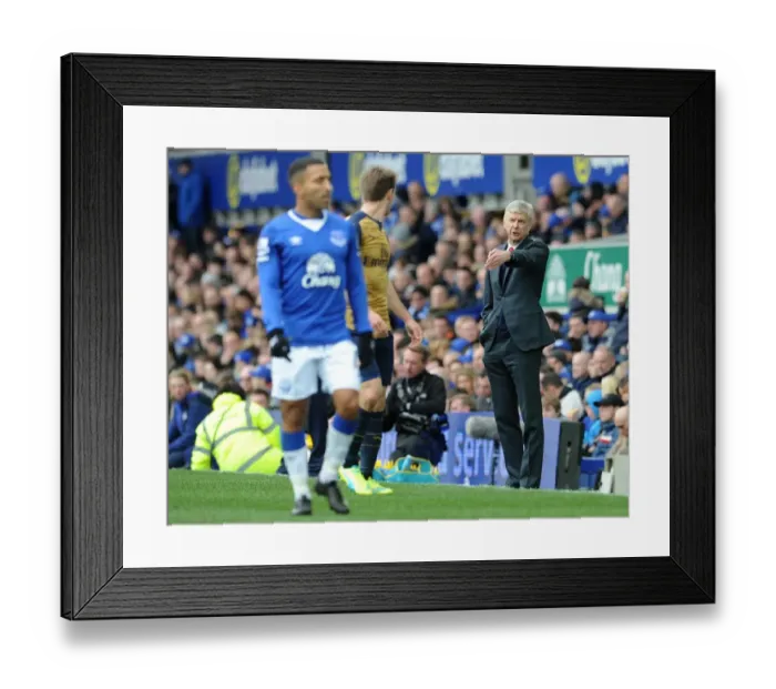 Framed Print : Arsene Wenger Guides Arsenal to a 2-0 Victory over Everton in the Barclays Premier League Framed Print : Arsene Wenger Guides Arsenal to a 2-0 Victory over Everton in the Barclays Premier League