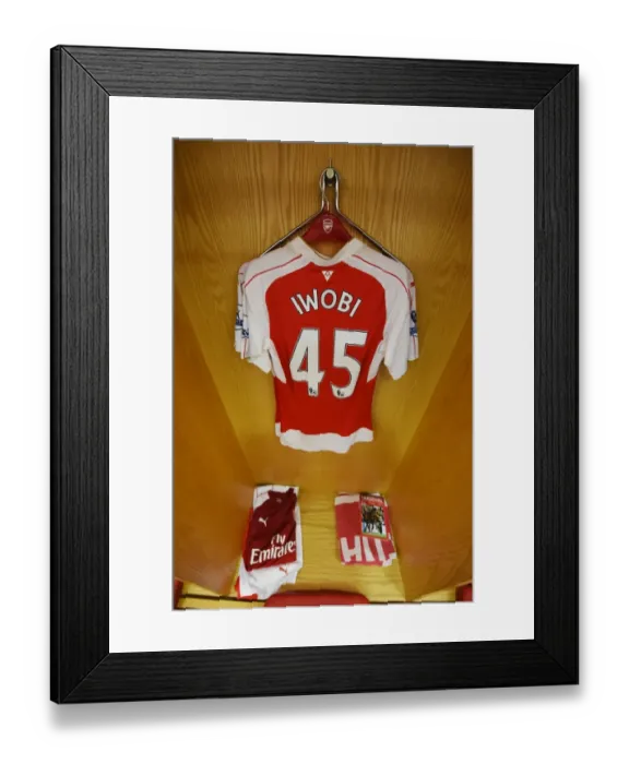 Framed Print : Arsenal Changing Room: A Pre-Match Glance at Alex Iwobi's Jersey (Arsenal vs. Watford, 2015-16)