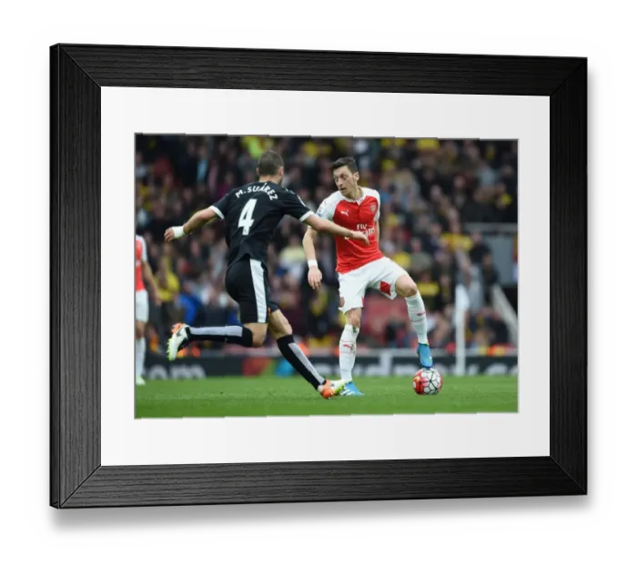 Framed Print : Mesut Ozil vs. Mario Suarez: A Premier League Showdown at Arsenal vs. Watford Framed Print : Mesut Ozil vs. Mario Suarez: A Premier League Showdown at Arsenal vs. Watford