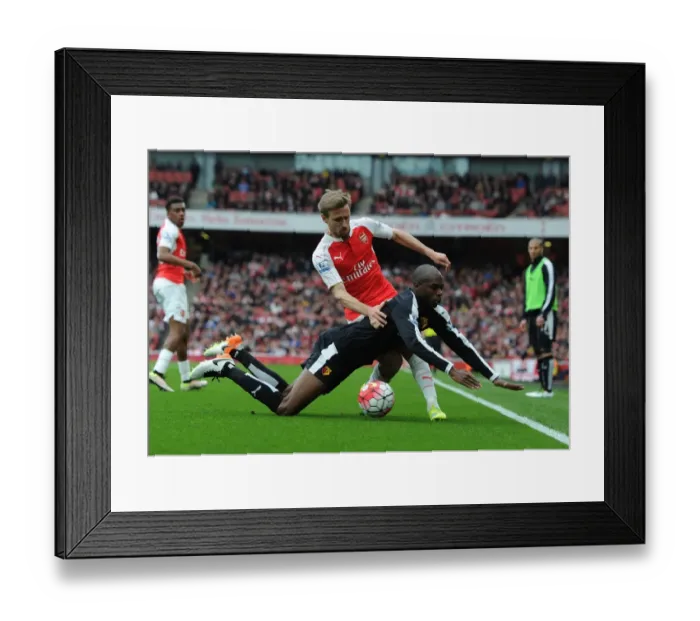 Framed Print : Monreal vs. Nyom: Intense Battle in Arsenal vs. Watford Premier League Clash Framed Print : Monreal vs. Nyom: Intense Battle in Arsenal vs. Watford Premier League Clash