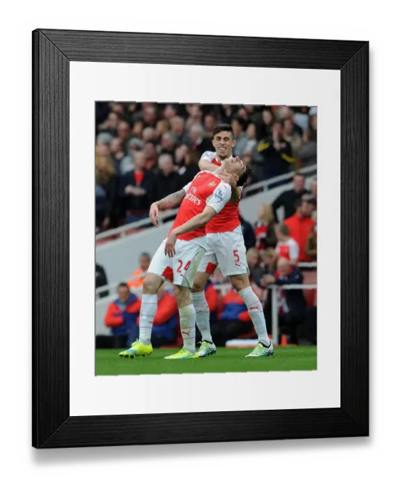 Framed Print : Arsenal's Unstoppable Duo: Bellerin and Gabriel's Goal Celebration vs. Watford (2015-16)