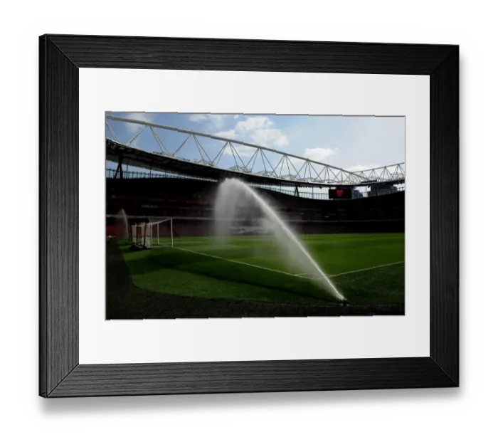 Framed Print : The pitch is watered before the match. Arsenal 4: 0 Watford. Barclays Premier League Framed Print : The pitch is watered before the match. Arsenal 4: 0 Watford. Barclays Premier League