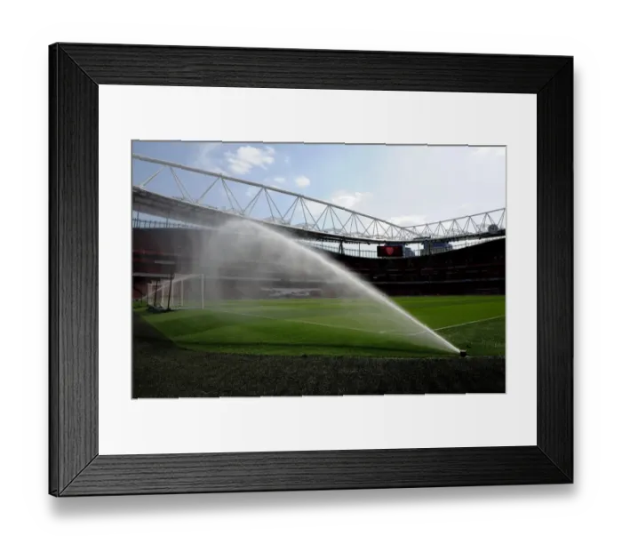Framed Print : Arsenal's Dominant Performance: 4-0 Win Against Watford in a Rain-Soaked Emirates