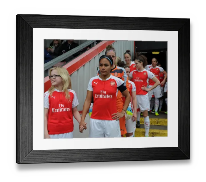 Framed Print : Alex Scott (Arsenal Ladies) with the mascot. Arsenal Ladies 2: 2 Notts County Ladies
