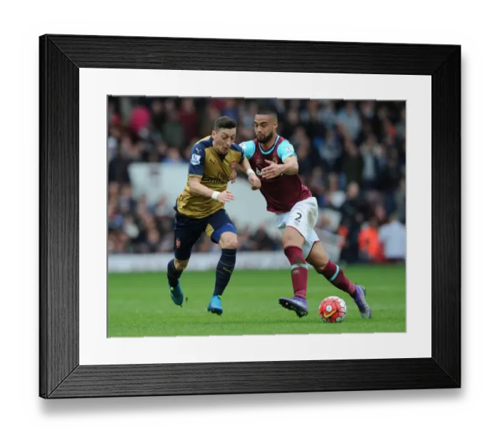 Framed Print : Intense Clash: Mesut Ozil vs. Winston Reid - Arsenal vs. West Ham (April 2016) Framed Print : Intense Clash: Mesut Ozil vs. Winston Reid - Arsenal vs. West Ham (April 2016)