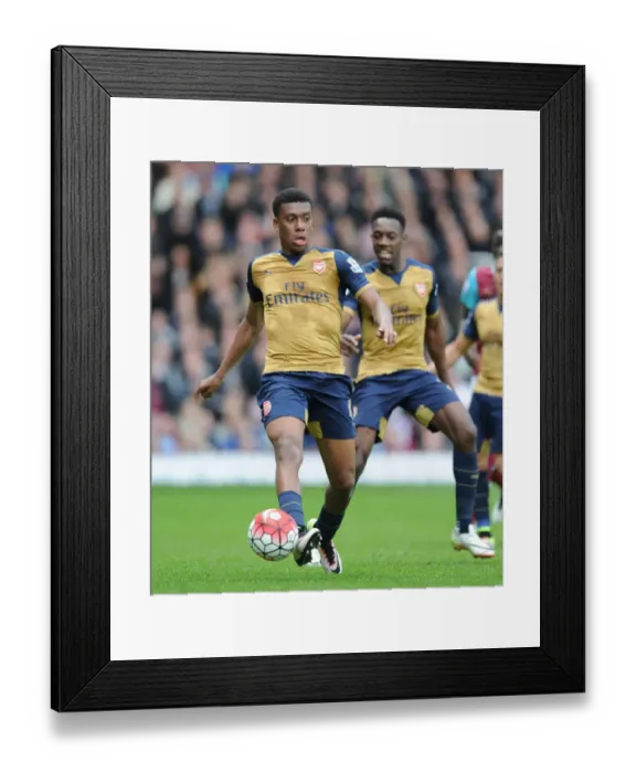 Framed Print : Arsenal's Alex Iwobi Faces Off Against West Ham United in Premier League Clash (2015-16) Framed Print : Arsenal's Alex Iwobi Faces Off Against West Ham United in Premier League Clash (2015-16)