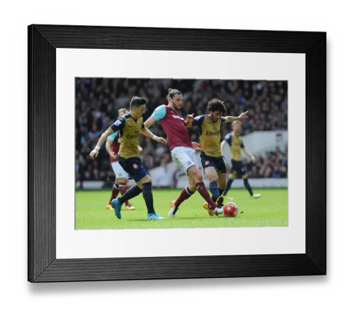 Framed Print : Intense Rivalry: Ozil, Elneny vs. Carroll - A Football Battle at the Boleyn Ground (2015-16)