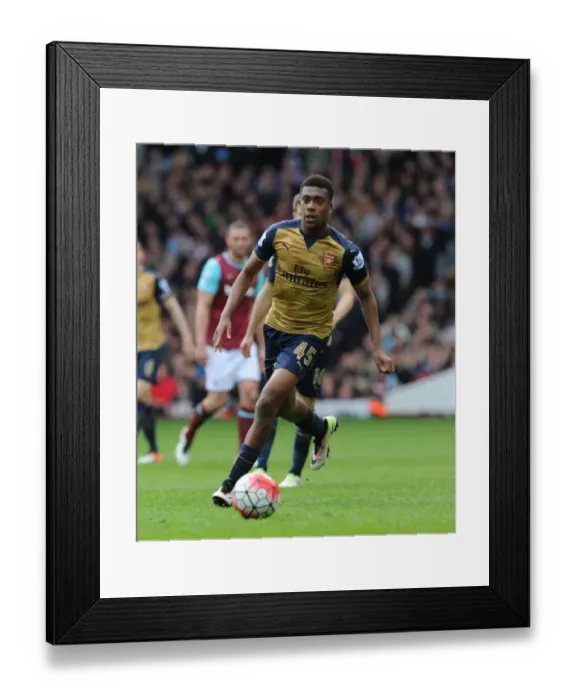 Framed Print : Arsenal's Alex Iwobi Goes Head-to-Head with West Ham in Intense Premier League Showdown (2015-16)