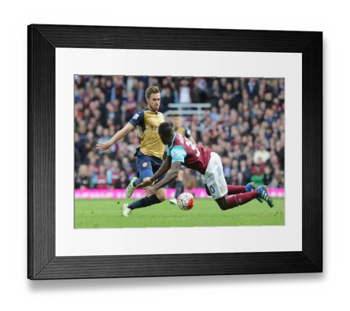 Framed Print : Ramsey vs. Antonio: A Premier League Battle at The Boleyn Ground