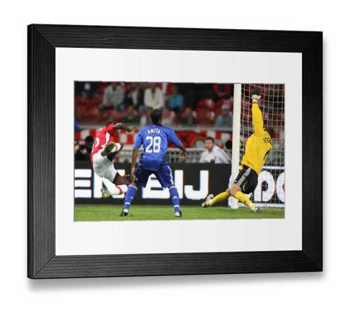 Framed Print : Emmanuel Adebayor heads past Maarten Stekelenburg to Framed Print : Emmanuel Adebayor heads past Maarten Stekelenburg to