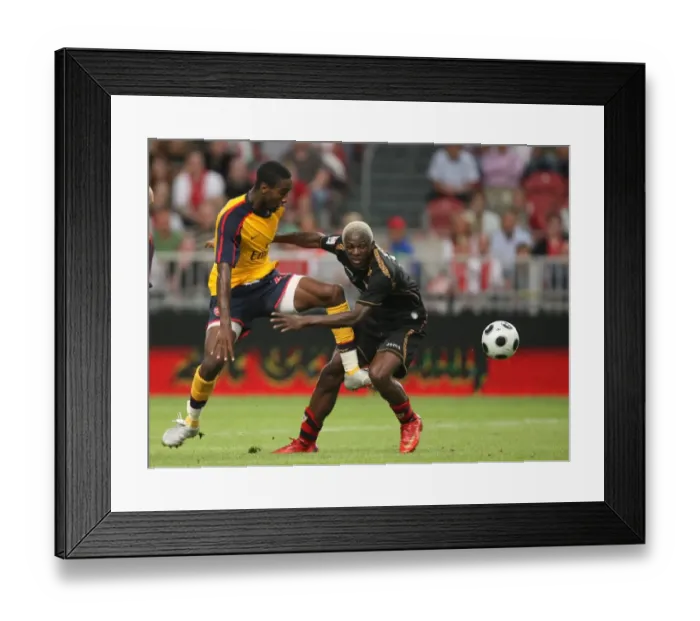 Framed Print : Johan Djourou (Arsenal) Arouna Kone (Seville)