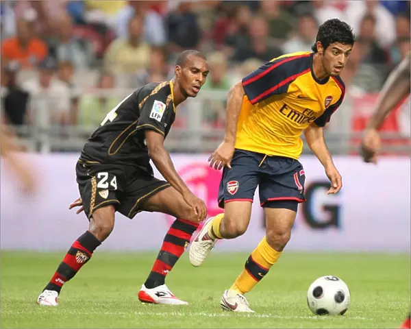 Carlos Vela (Arsenal) Abdoulay Konko (Seville)