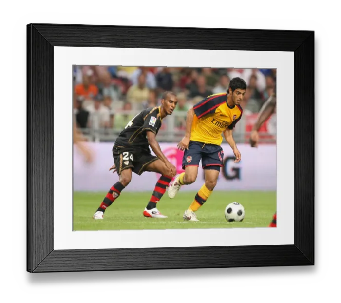 Framed Print : Carlos Vela (Arsenal) Abdoulay Konko (Seville) Framed Print : Carlos Vela (Arsenal) Abdoulay Konko (Seville)