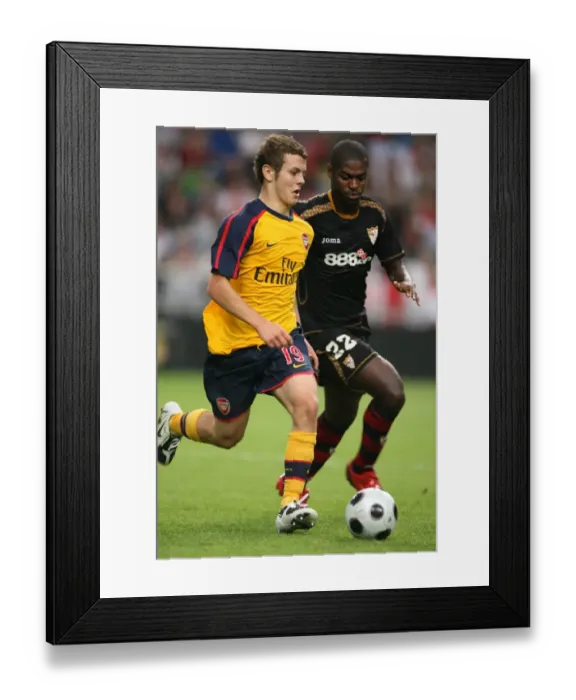Framed Print : Jack Wilshere (Arsenal) Ndri Romaric (Seville)