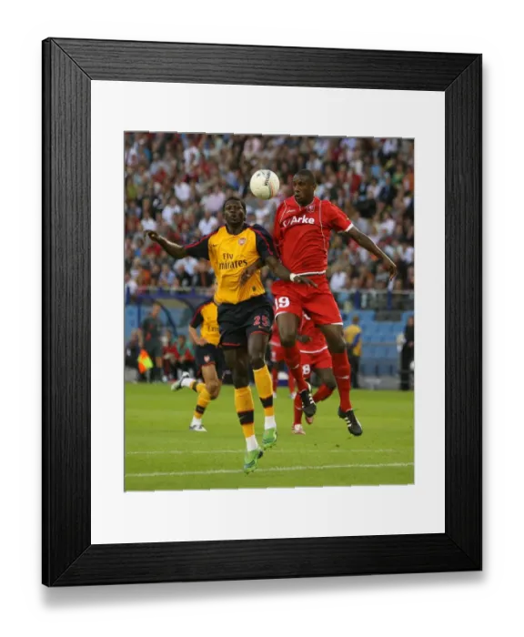 Framed Print : Emmanuel Adebayor (Arsenal) Douglas (FC Twente) Framed Print : Emmanuel Adebayor (Arsenal) Douglas (FC Twente)
