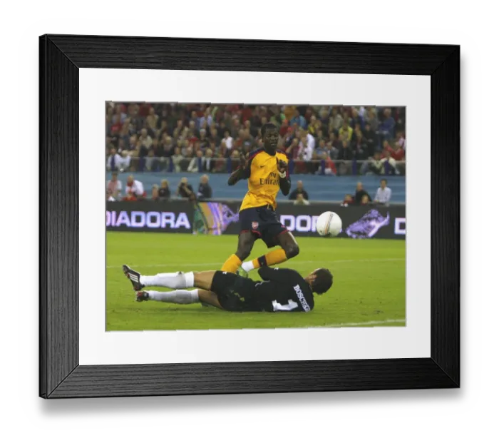 Framed Print : Emmanuel Adebayor shoots past FC Twente goalkeeper Framed Print : Emmanuel Adebayor shoots past FC Twente goalkeeper