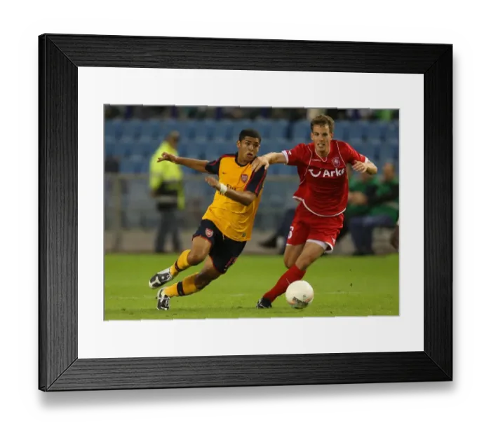 Framed Print : Arsenal's Double Victory Over FC Twente: Denilson and Wout Brama Shine in 2-0 Champions League Triumph Framed Print : Arsenal's Double Victory Over FC Twente: Denilson and Wout Brama Shine in 2-0 Champions League Triumph